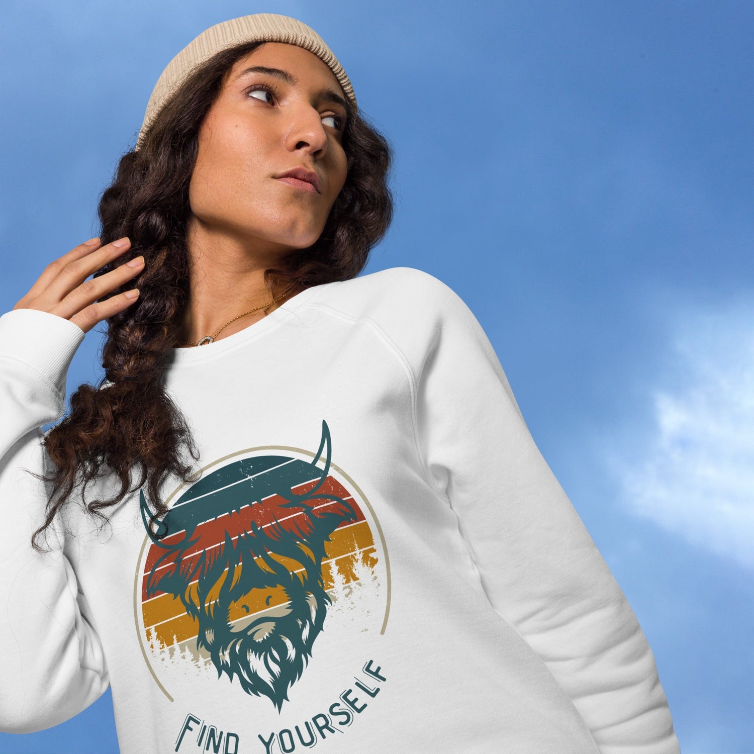 young black woman pulling a sweatshirt hood over her head smiling 