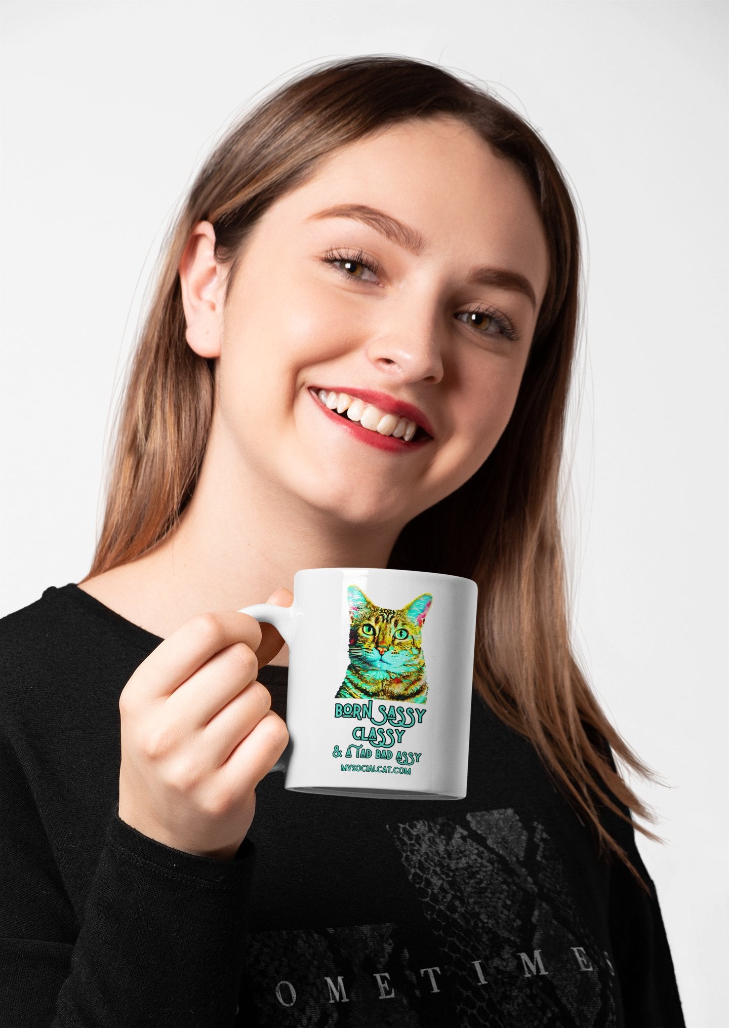 young woman red lips holding a white glossy mug next to her face smiling cat