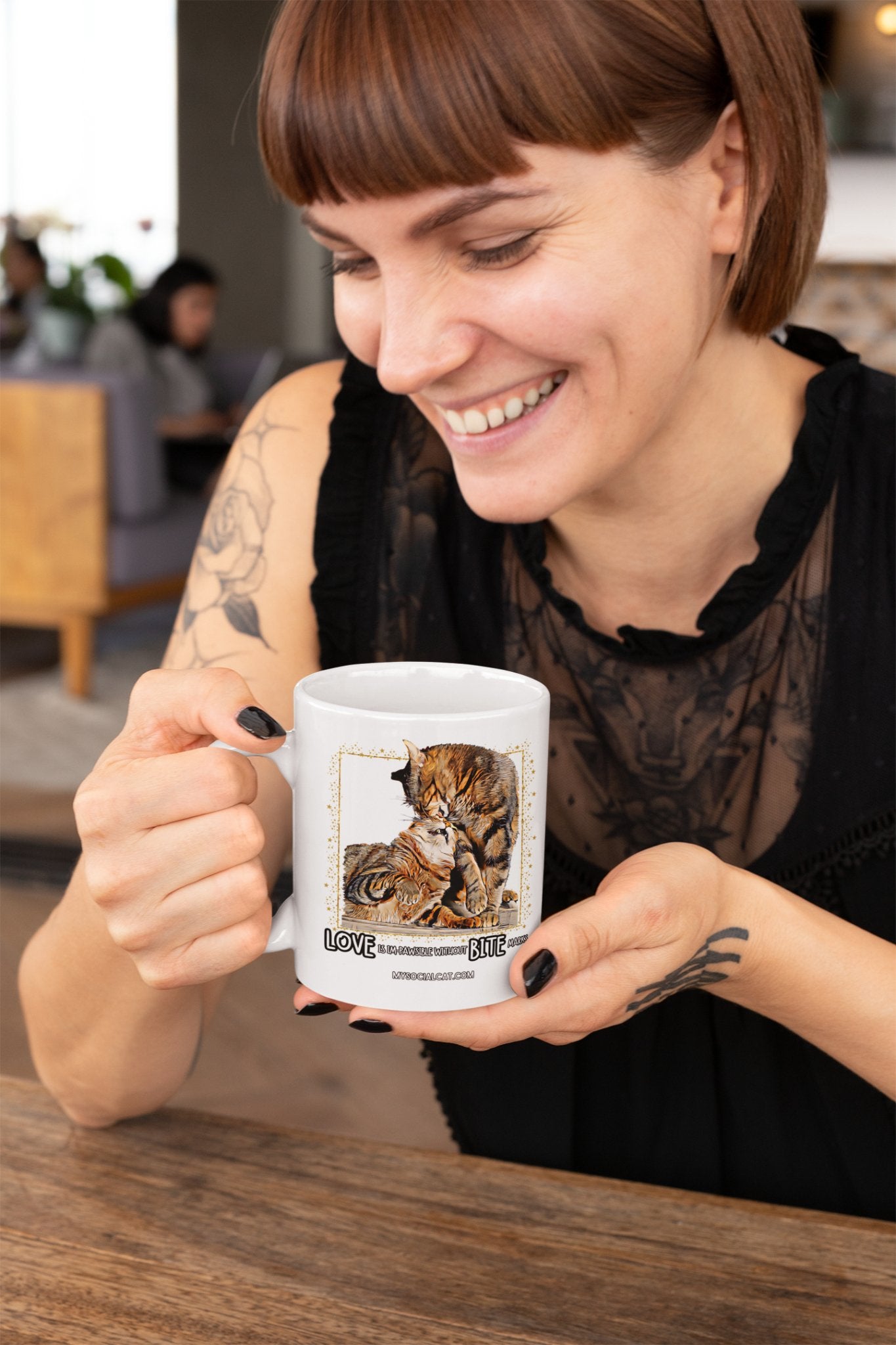 mockup-of-a-smiling-tattooed-woman-holding-an-11oz-coffee-mug-27233_1-501194 mysocialcat.com