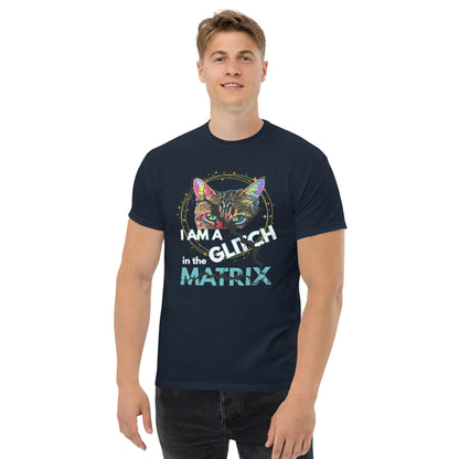 A man wearing a navy blue graphic t-shirt with a colorful cat illustration and the text 'I AM A GLITCH IN THE MATRIX'.