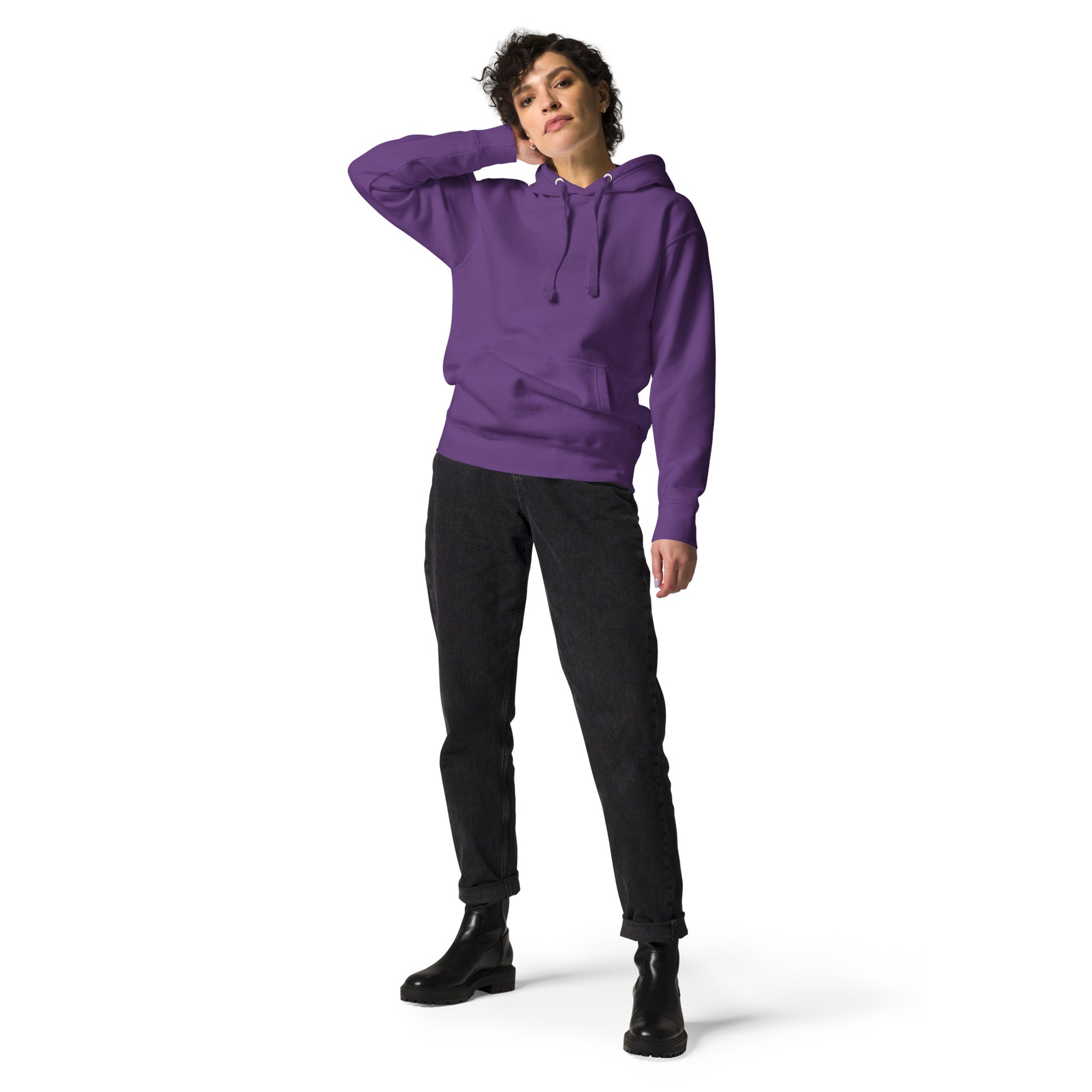 tall young woman wearing purple hoodie on white background
