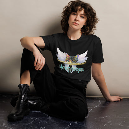 Person wearing a black t-shirt with a colorful graphic design sitting on a dark surface.