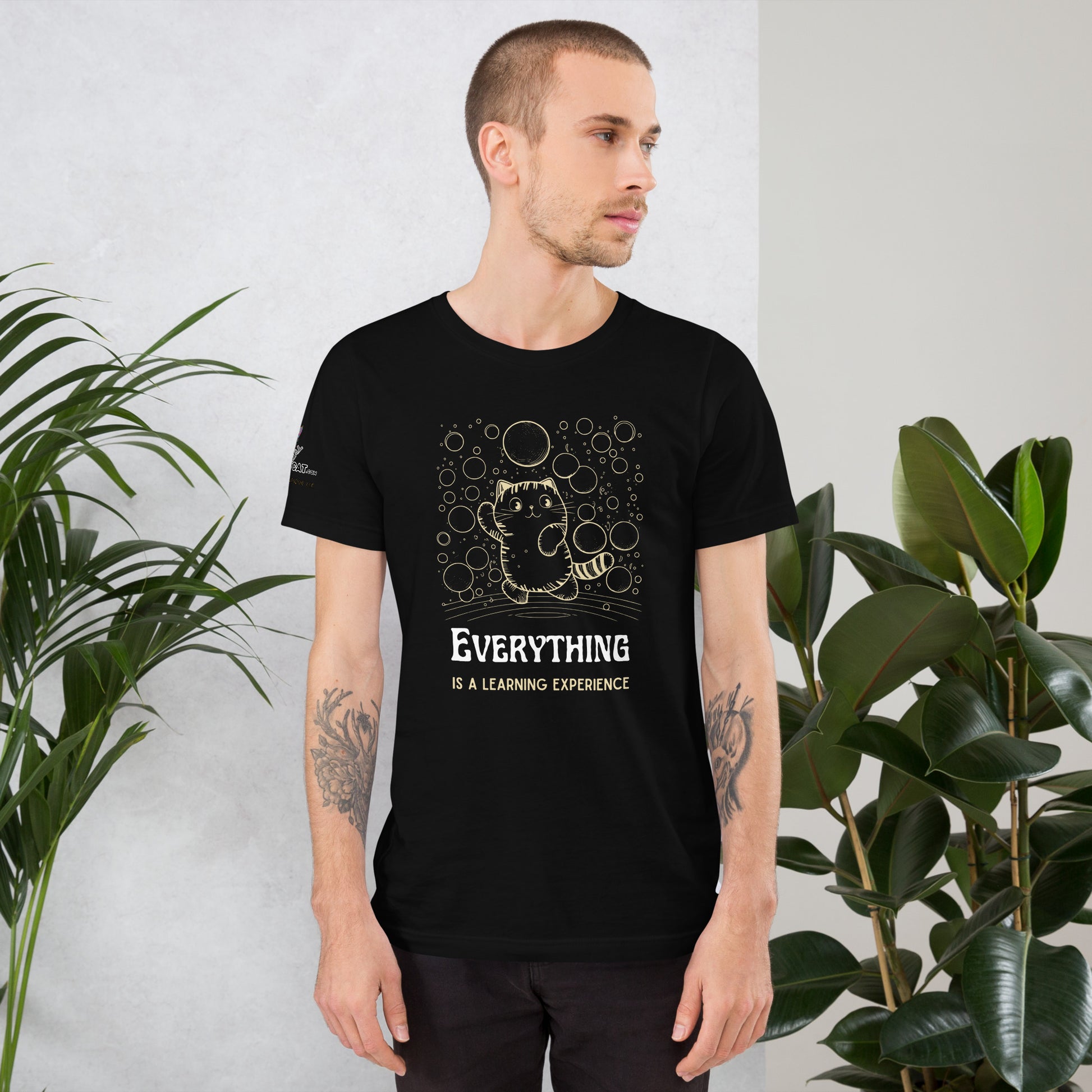 young white male with arm tattoos wearing black tshirt in studio 