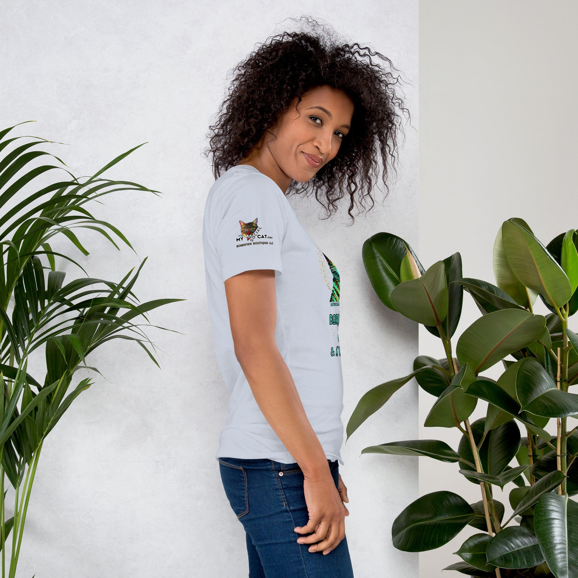 young woman wearing light blue tshirt and jeans smiling right side view