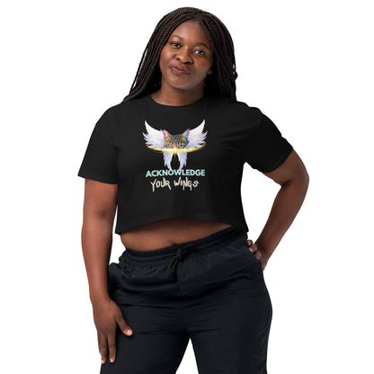 Person wearing a black crop top with a red and white graphic design on a white background