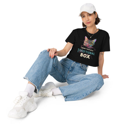 Person wearing a black t-shirt with 'LGBTQ' text and graphics, sitting on a white background
