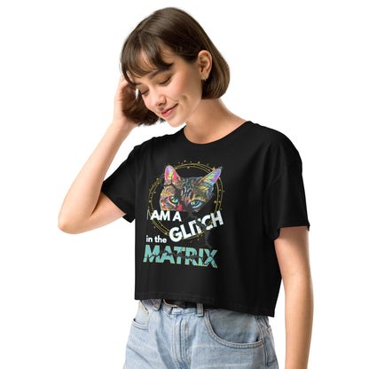 Woman wearing a black t-shirt with 'I am a glitch in the matrix' text on a white background