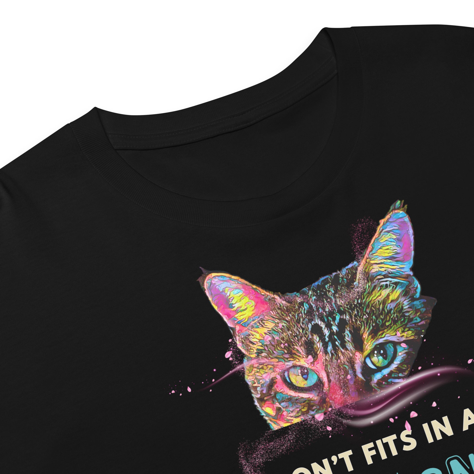 Close-up of a black short-sleeve T-shirt with a colorful graphic of a cat's face and partial text on the front, shown against a white background.